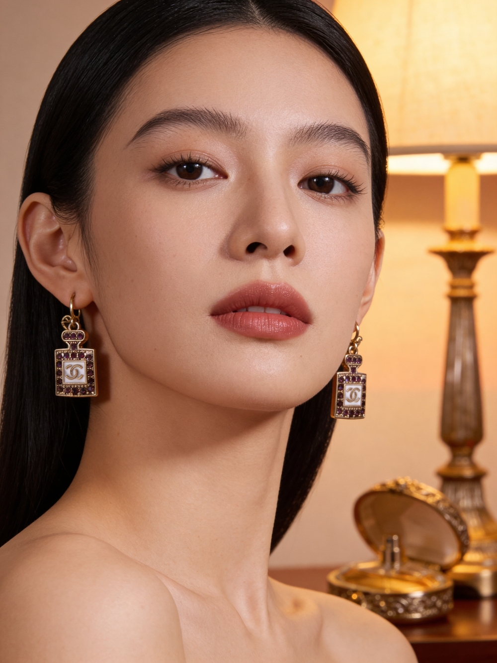 Chan*l Perfume Bottle Dangle Earrings in Gold with Purple Stones